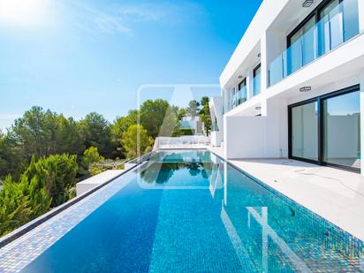 Vista exterior de Casa adosada en venda en Moraira amb Aire condicionat, Calefacció i Jardí privat