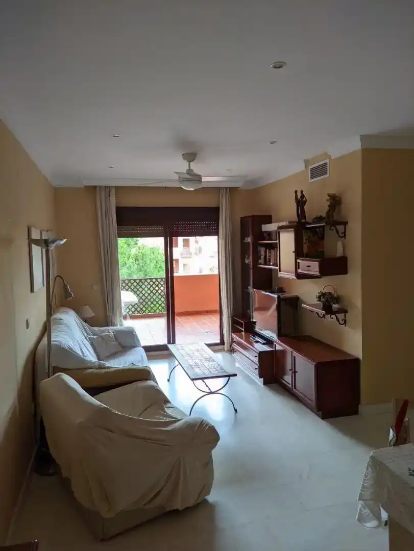 Sala d'estar de Apartament de lloguer en Motril amb Piscina