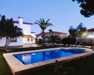 Vista exterior de Casa o xalet en venda en Almonte amb Terrassa, Traster i Piscina