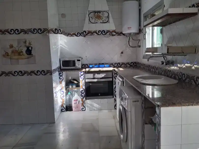 Cuina de Casa adosada en venda en  Sevilla Capital amb Aire condicionat i Piscina