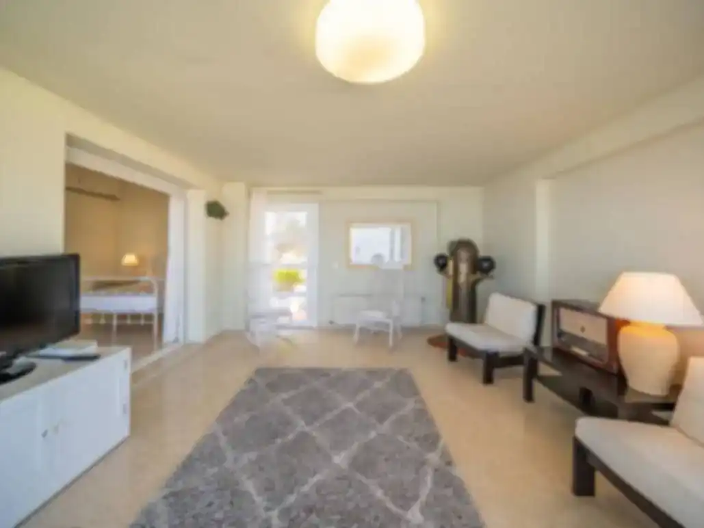 Sala de estar de Piso de alquiler en L'Escala con Aire acondicionado, Piscina y Amueblado