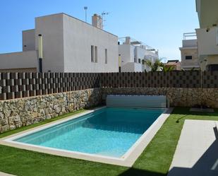 Swimming pool of Single-family semi-detached for sale in Pilar de la Horadada  with Air Conditioner, Heating and Private garden