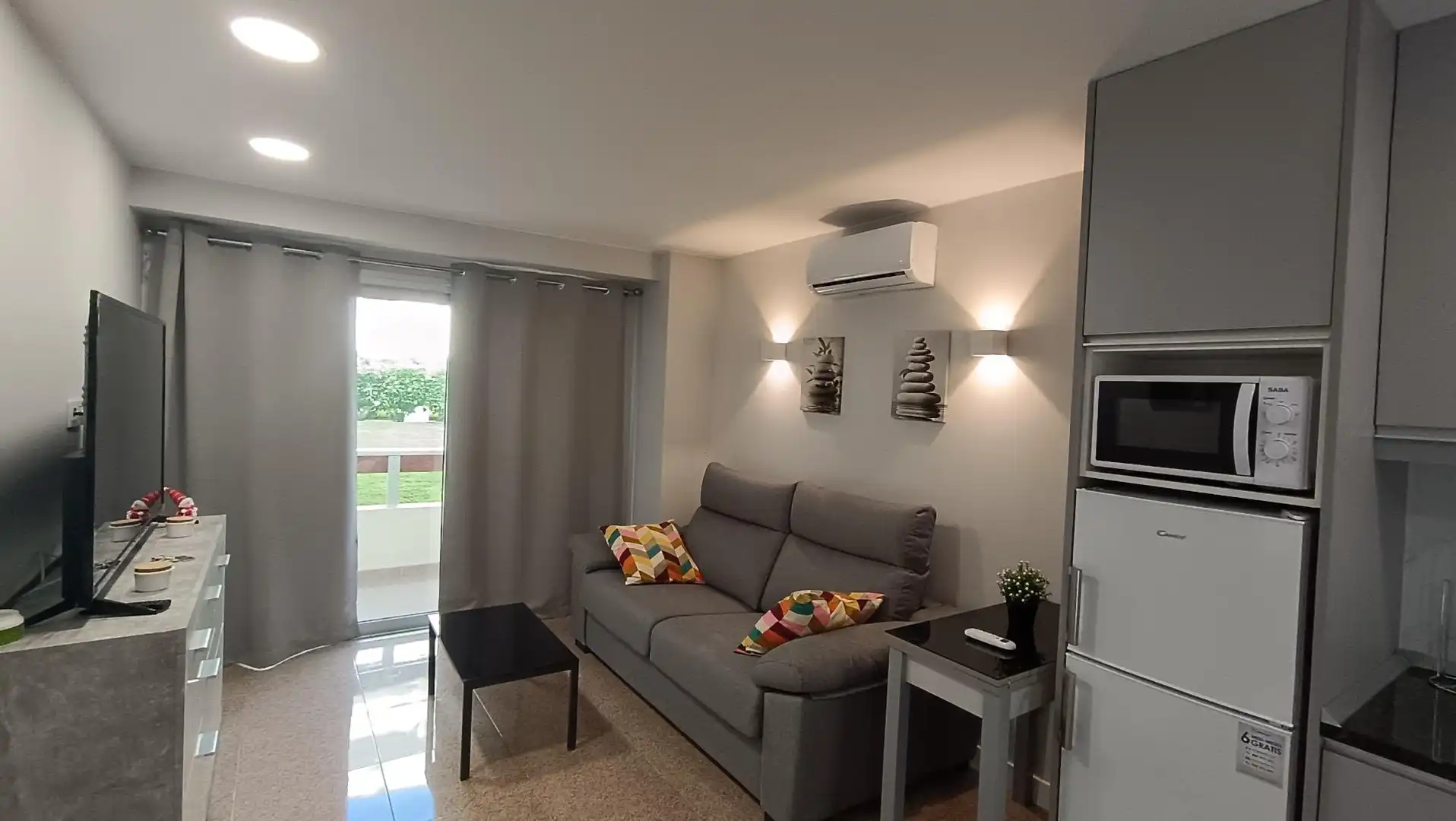 Sala d'estar de Apartament en venda en San Bartolomé de Tirajana amb Aire condicionat, Terrassa i Moblat