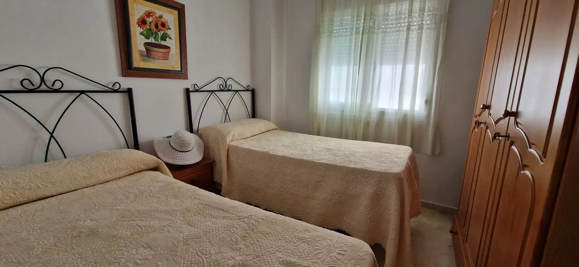 Dormitori de Apartament de lloguer en El Portil amb Moblat i Piscina comunitària