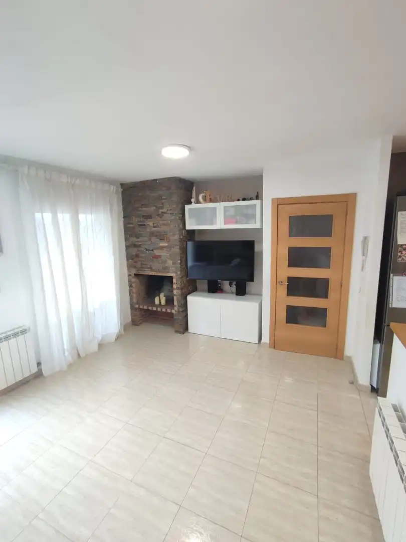 Sala de estar de Casa adosada en venta en Balaguer con Aire acondicionado, Calefacción y Jardín privado