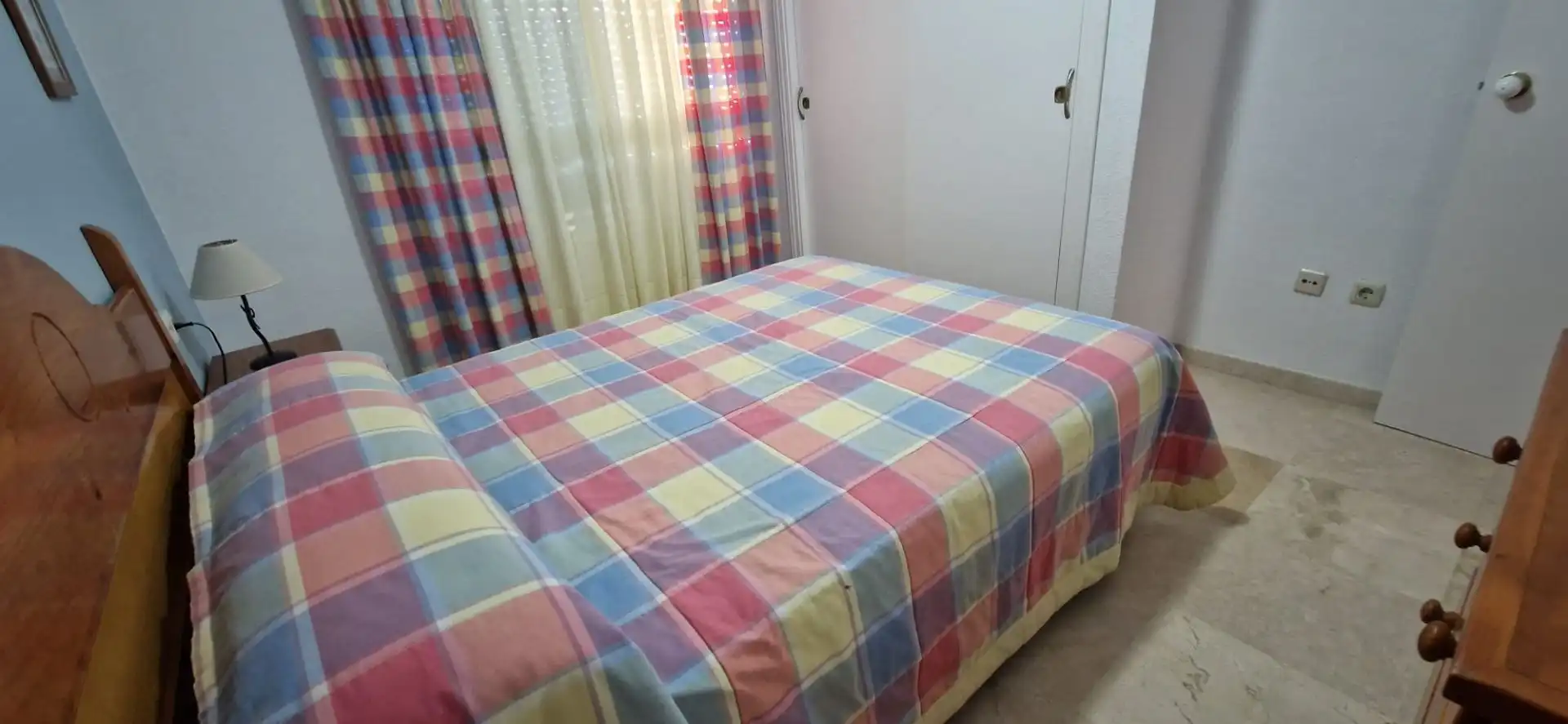 Dormitori de Apartament de lloguer en El Portil amb Piscina comunitària