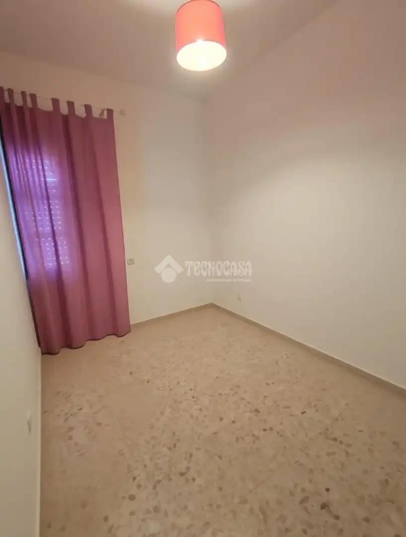 Dormitori de Casa adosada en venda en Marchena amb Aire condicionat