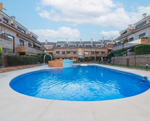 Swimming pool of Duplex for sale in Sevilla la Nueva  with Air Conditioner, Heating and Parquet flooring