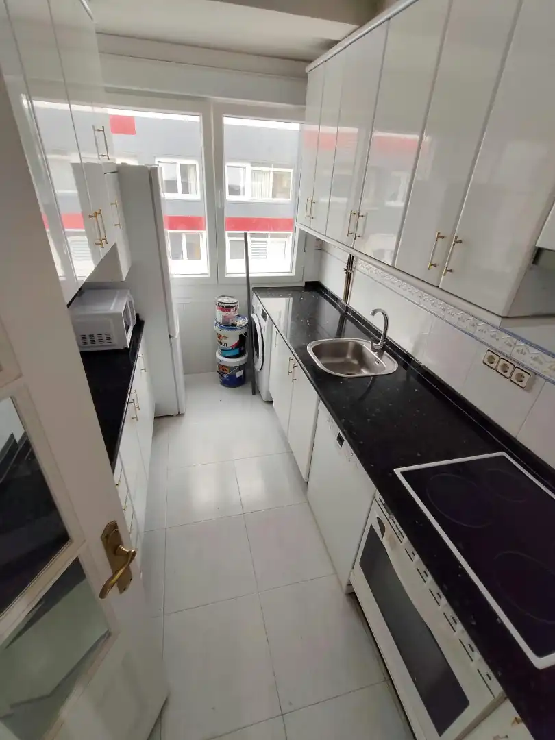 Kitchen of Flat for share in Os Mallos