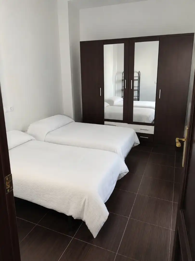 Habitación de Casa adosada en venta en Lora del Río con Aire acondicionado, Terraza y Trastero