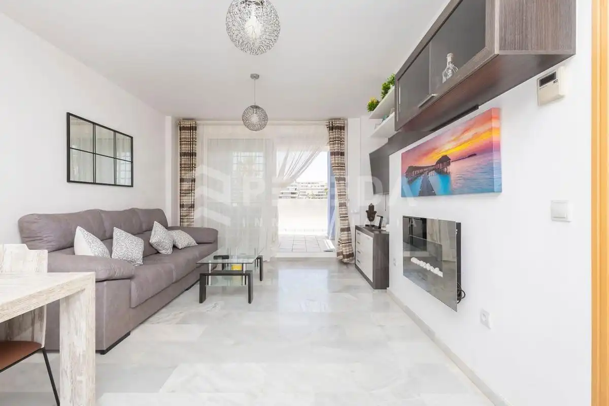 Living room of Ground floor for sale in Roquetas de Mar  with Air Conditioner, Private garden and Terrace
