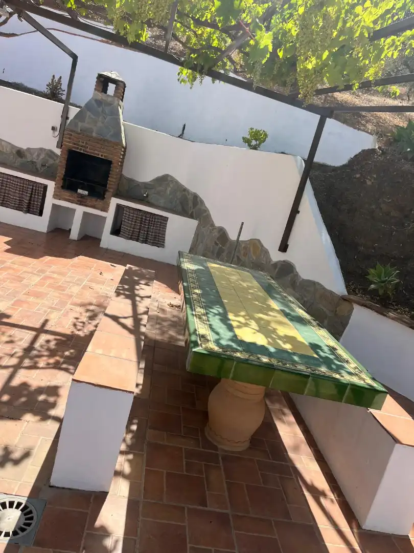 Terrassa de Finca rústica de lloguer en Sedella amb Aire condicionat, Jardí privat i Traster
