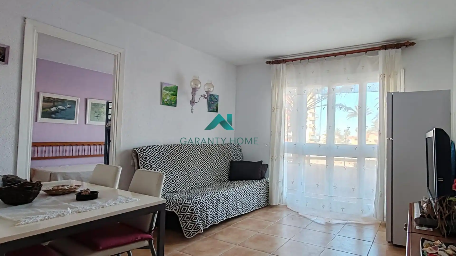 Sala de estar de Apartamento en venta en La Manga del Mar Menor con Amueblado, Balcón y Piscina comunitaria