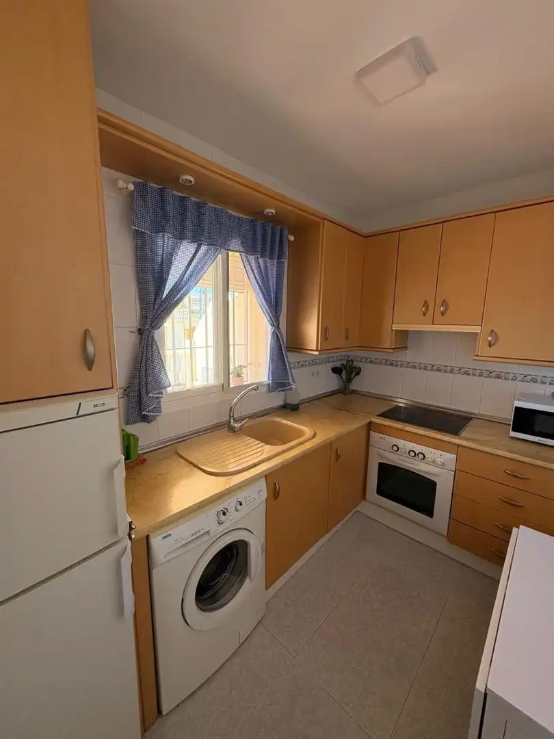 Cuina de Apartament de lloguer en Torrox amb Terrassa i Piscina comunitària