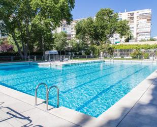 Swimming pool of Flat for sale in  Madrid Capital  with Air Conditioner and Terrace