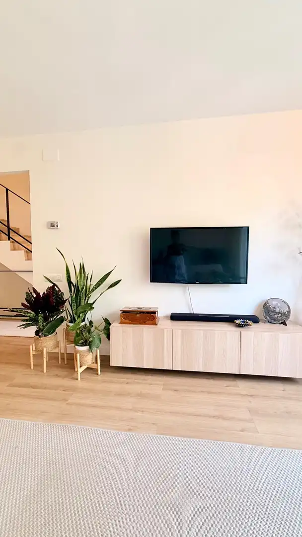Sala d'estar de Casa adosada en venda en Cunit amb Aire condicionat, Calefacció i Jardí privat