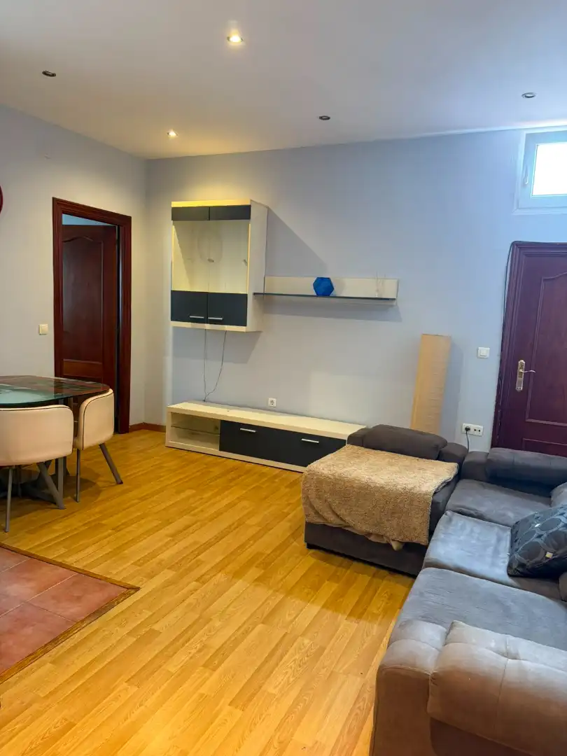 Living room of Flat for sale in Gijón   with Heating, Parquet flooring and Furnished