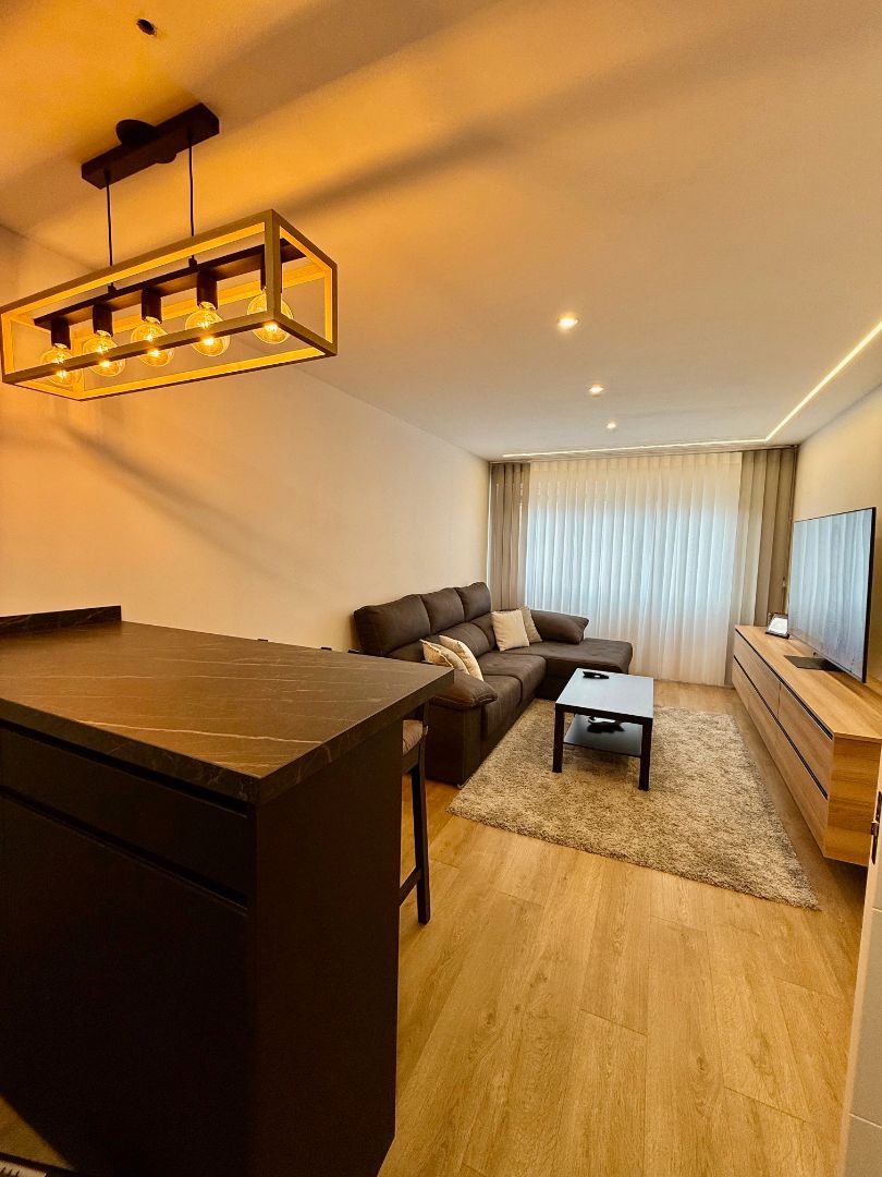 Living room of Apartment for sale in Gijón   with Heating, Private garden and Parquet flooring