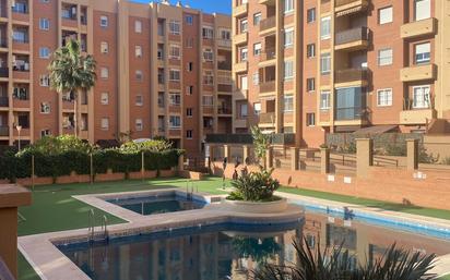 Swimming pool of Flat for sale in  Almería Capital  with Air Conditioner, Heating and Private garden