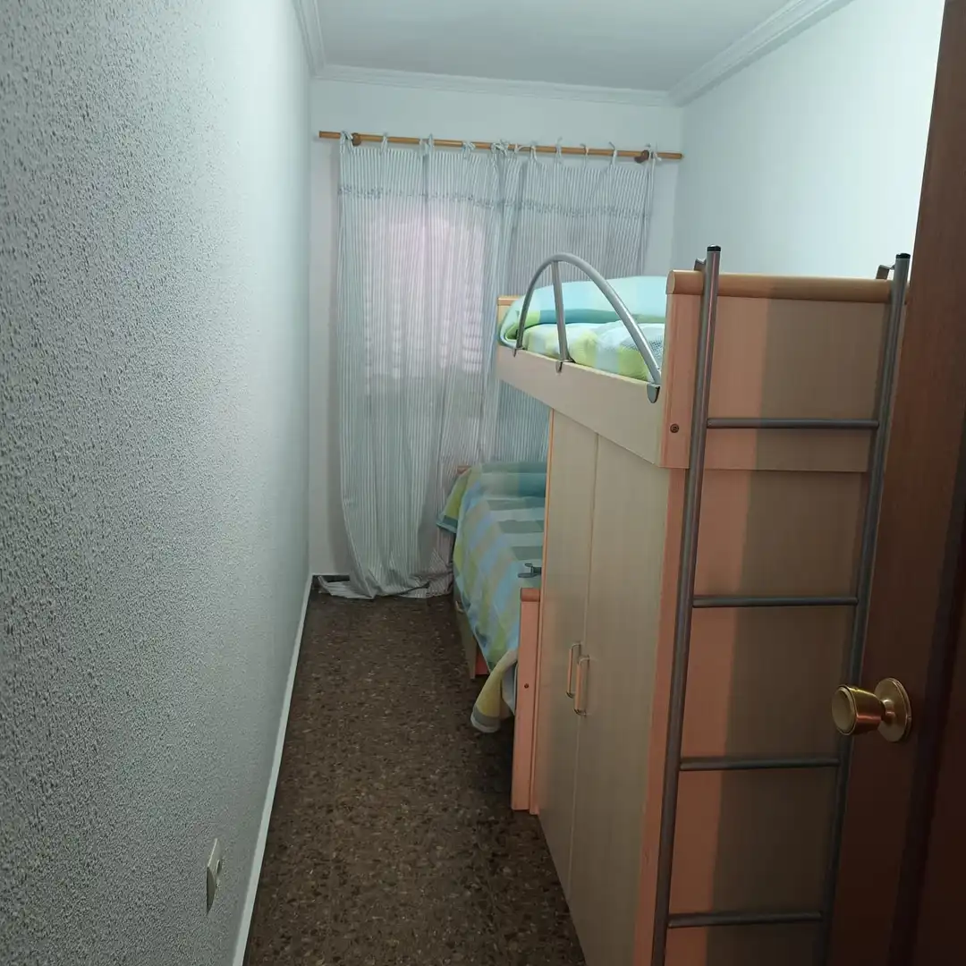 Habitación de Apartamento de alquiler en La Pobla de Farnals con Aire acondicionado, Calefacción y Jardín privado