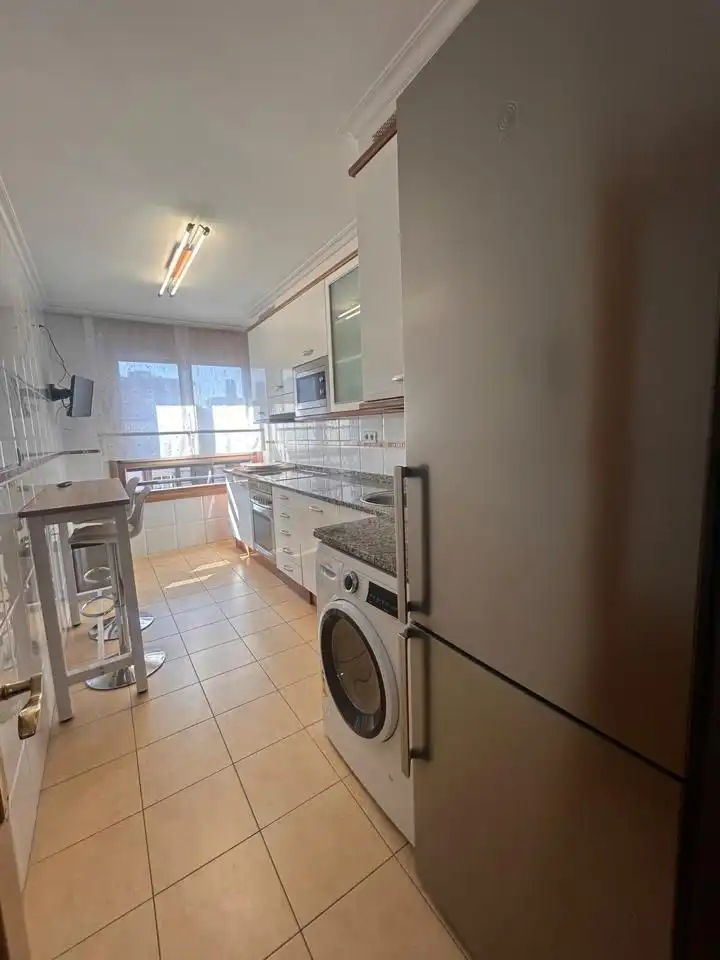 Kitchen of Flat for rent in Gijón   with Heating, Terrace and Storage room