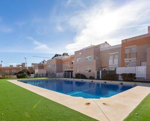 Swimming pool of Single-family semi-detached for sale in  Almería Capital  with Heating, Terrace and Community pool