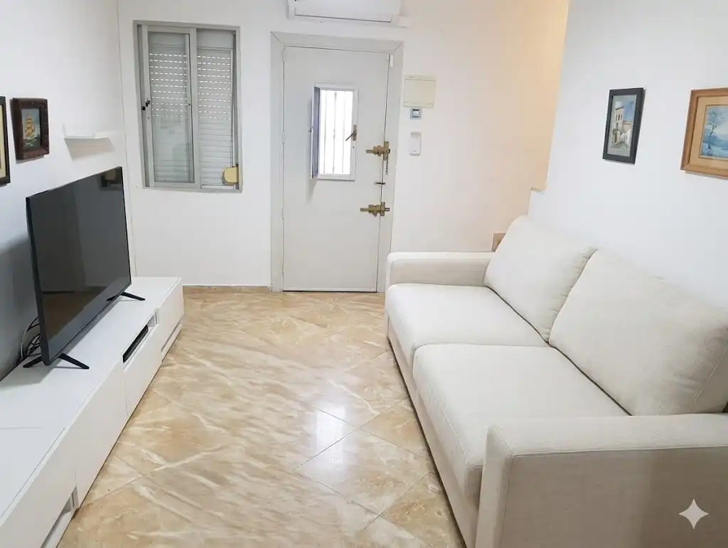 Sala de estar de Casa adosada en venta en Málaga Capital con Terraza, Horno y Microondas