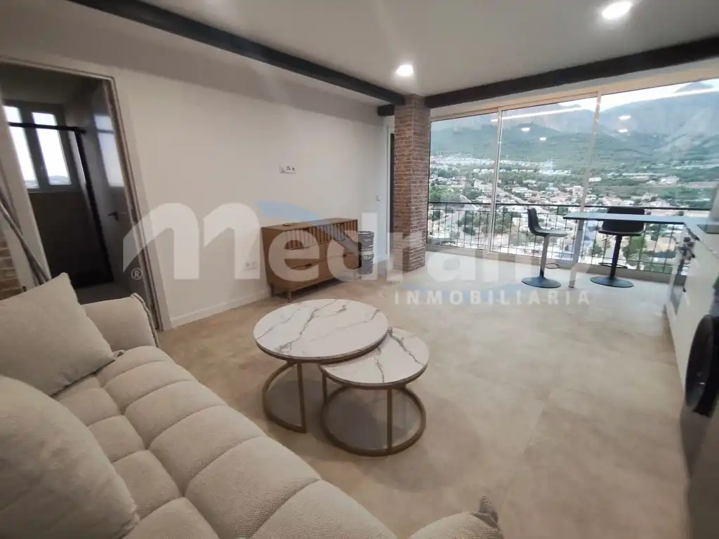 Sala de estar de Apartamento de alquiler en La Nucia con Aire acondicionado, Calefacción y Jardín privado