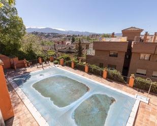 Swimming pool of Planta baja for sale in  Granada Capital  with Air Conditioner and Terrace