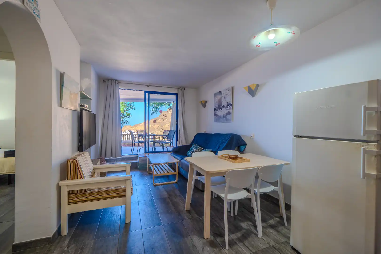 Sala d'estar de Apartament en venda en Mogán amb Aire condicionat, Terrassa i Moblat