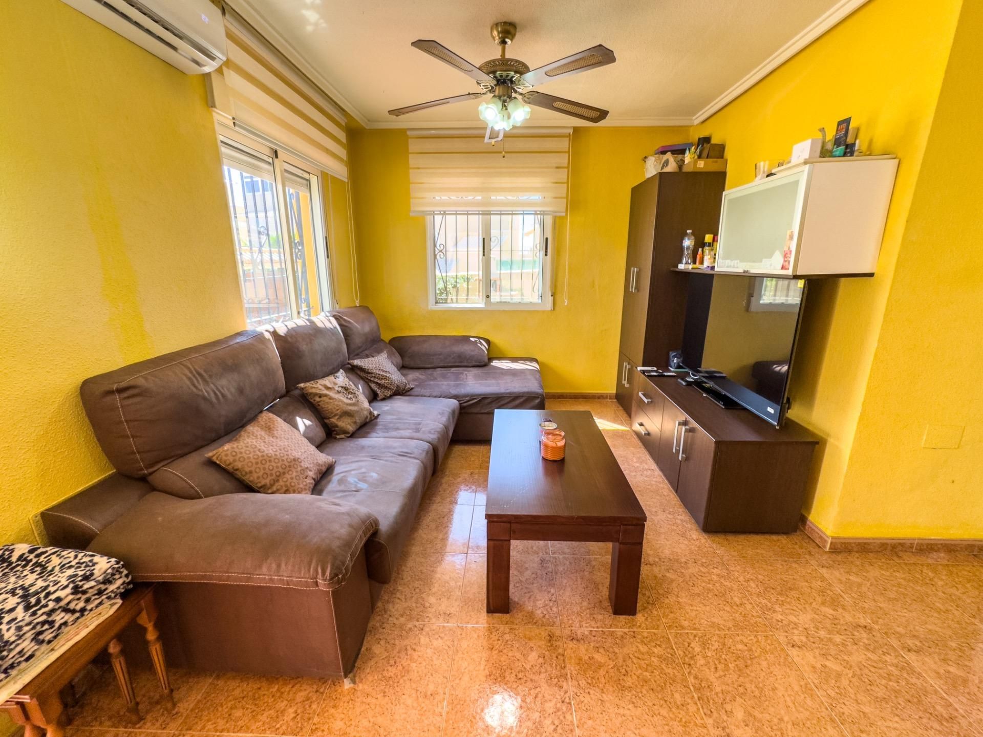 Sala de estar de Casa adosada en venta en Orihuela con Aire acondicionado, Jardín privado y Terraza