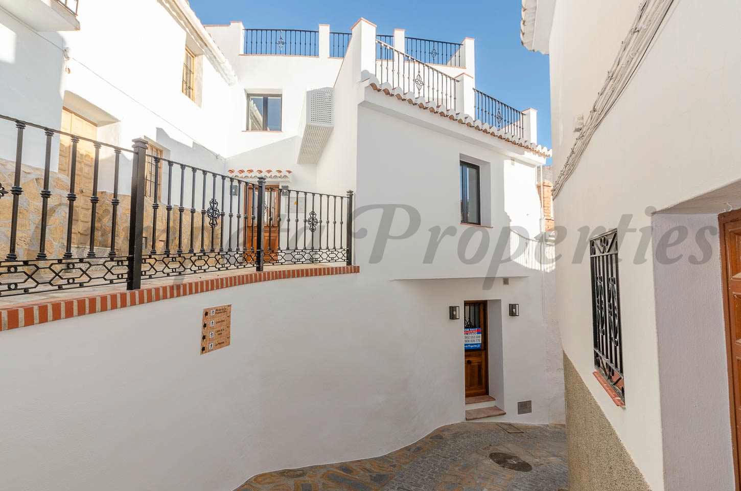 Exterior view of Single-family semi-detached for sale in Sedella  with Air Conditioner and Terrace