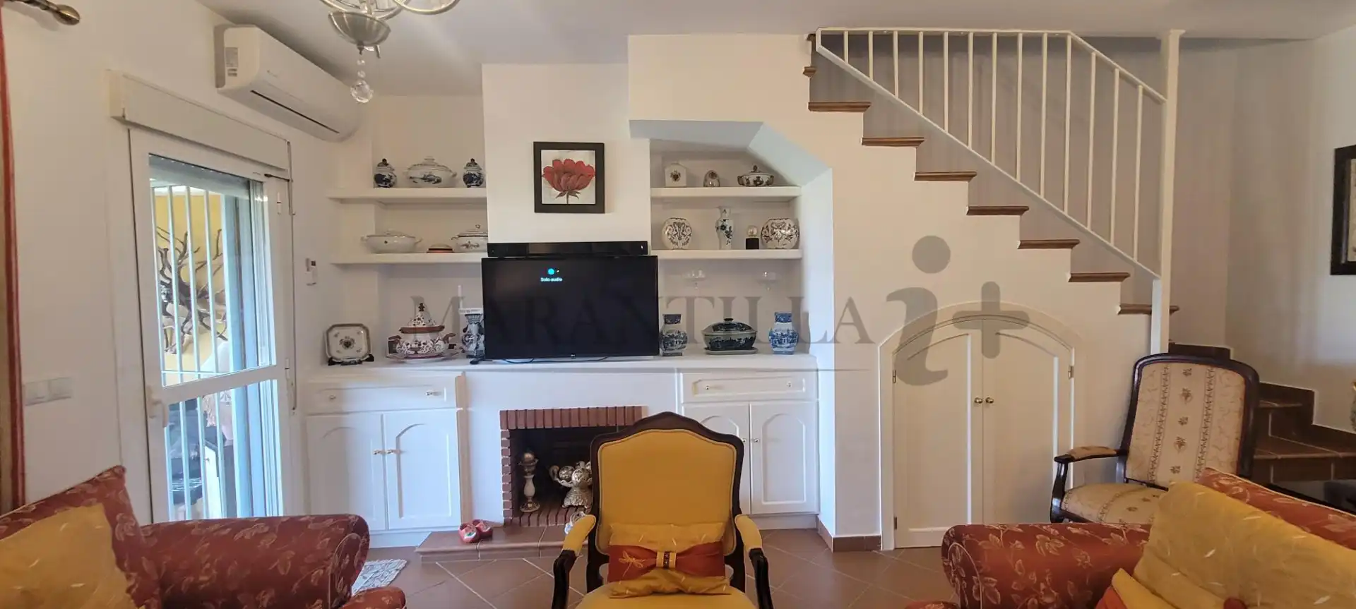 Sala de estar de Casa adosada en venta en Islantilla con Aire acondicionado, Calefacción y Jardín privado