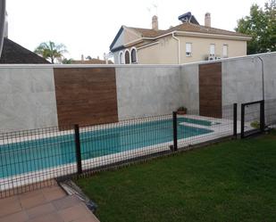 Swimming pool of Single-family semi-detached for sale in Utrera  with Air Conditioner, Private garden and Storage room