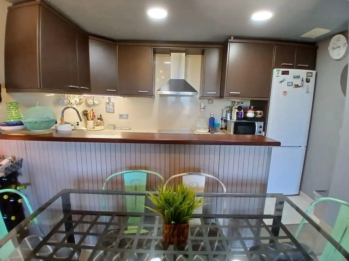 Cuina de Apartament en venda en Sant Jaume d'Enveja amb Moblat, Balcó i Piscina comunitària