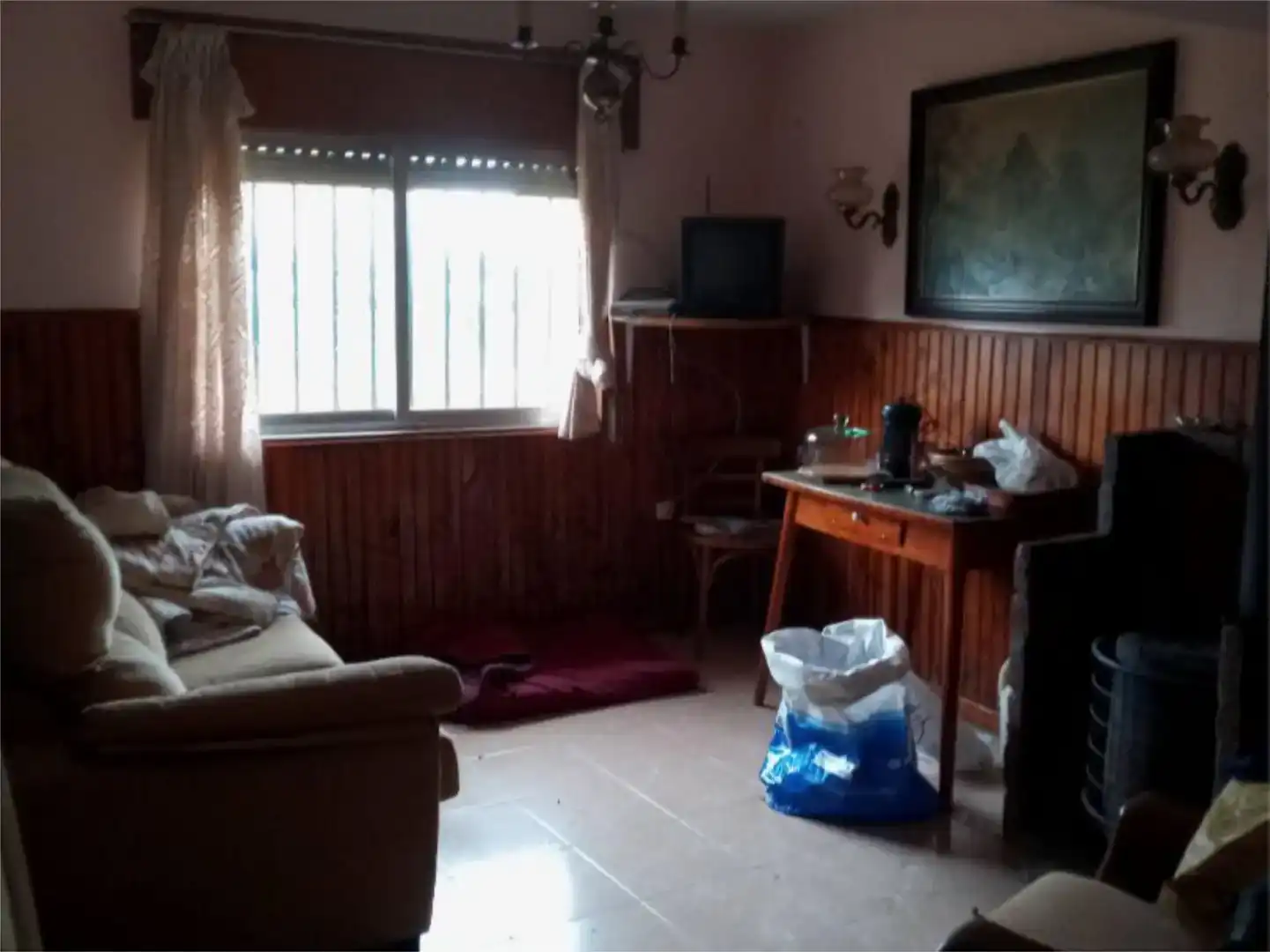 Sala d'estar de Casa adosada en venda en El Burgo Ranero 
