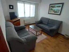 Sala d'estar de Pis de lloguer en Gijón  amb Calefacció, Parquet i Moblat