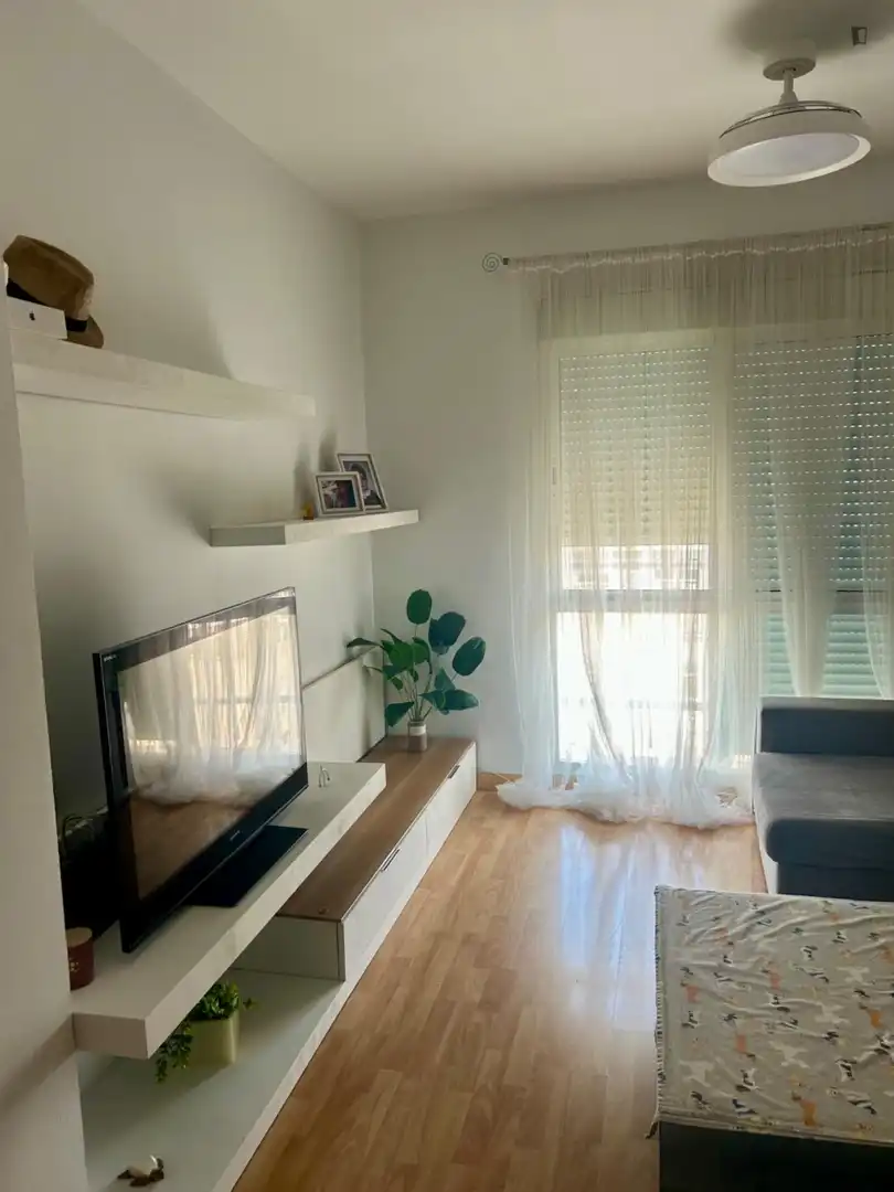 Sala d'estar de Apartament per a compartir en  Sevilla Capital amb Aire condicionat, Moblat i Forn