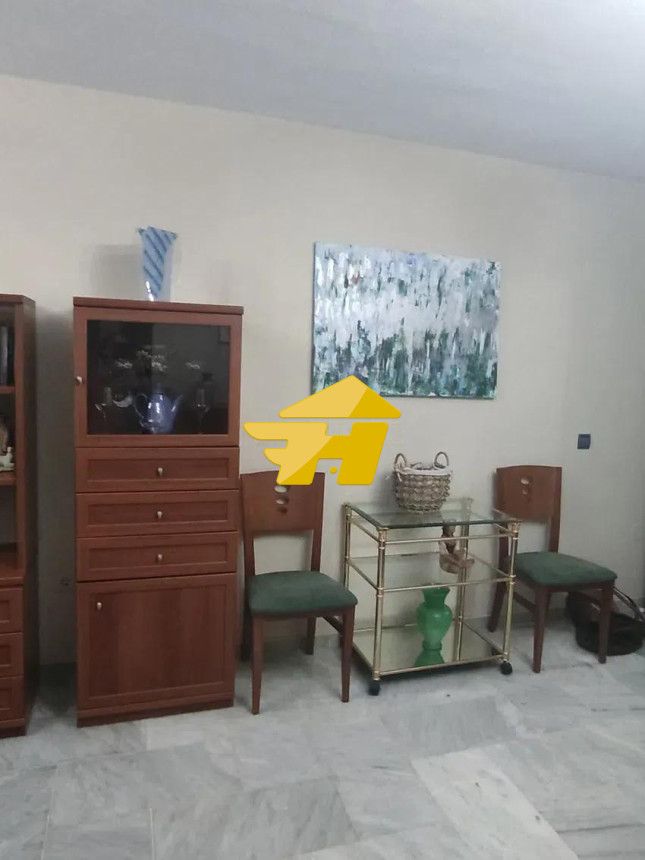 Sala d'estar de Pis de lloguer en Fuengirola amb Aire condicionat, Jardí privat i Piscina