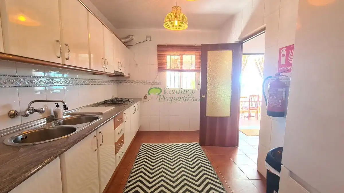 Cocina de Finca rústica en venta en Vélez-Málaga con Aire acondicionado, Jardín privado y Terraza