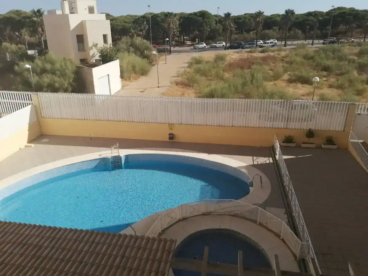 Schwimmbecken von Wohnung zum Verkauf in Isla Cristina mit Schwimmbad