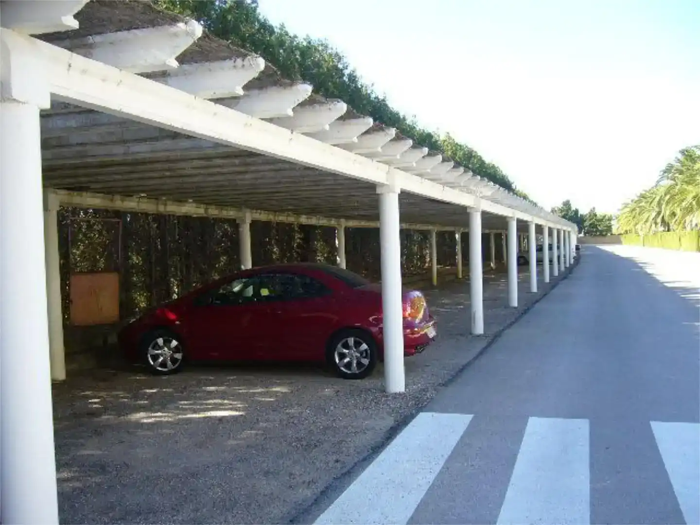 Aparcament de Apartament de lloguer en Dénia amb Aire condicionat, Jardí privat i Piscina