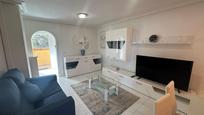 Sala d'estar de Apartament en venda en Benidorm amb Jardí privat, Terrassa i Piscina comunitària