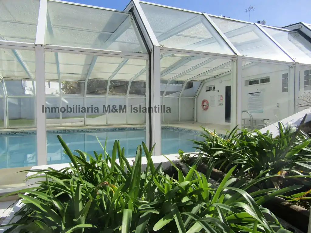 Piscina de Casa adosada en venta en Islantilla con Terraza, Trastero y Amueblado