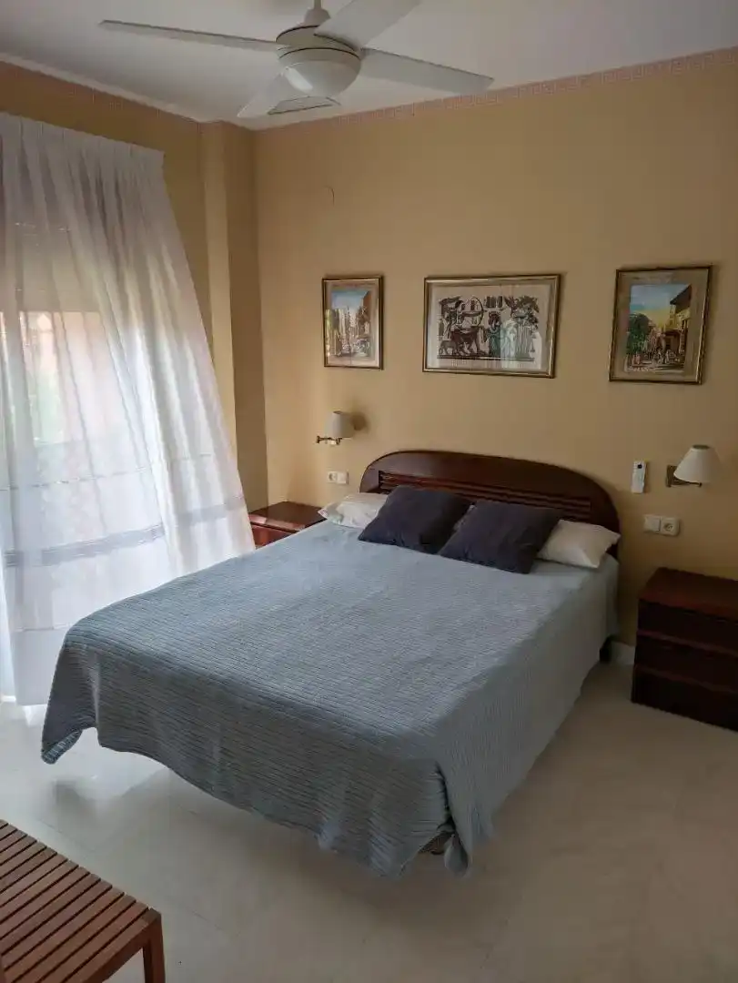 Dormitori de Apartament de lloguer en Motril amb Piscina