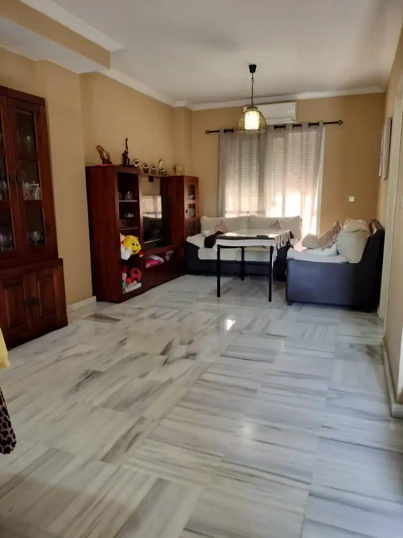 Sala de estar de Casa o chalet en venta en Coria del Río con Aire acondicionado, Terraza y Piscina comunitaria