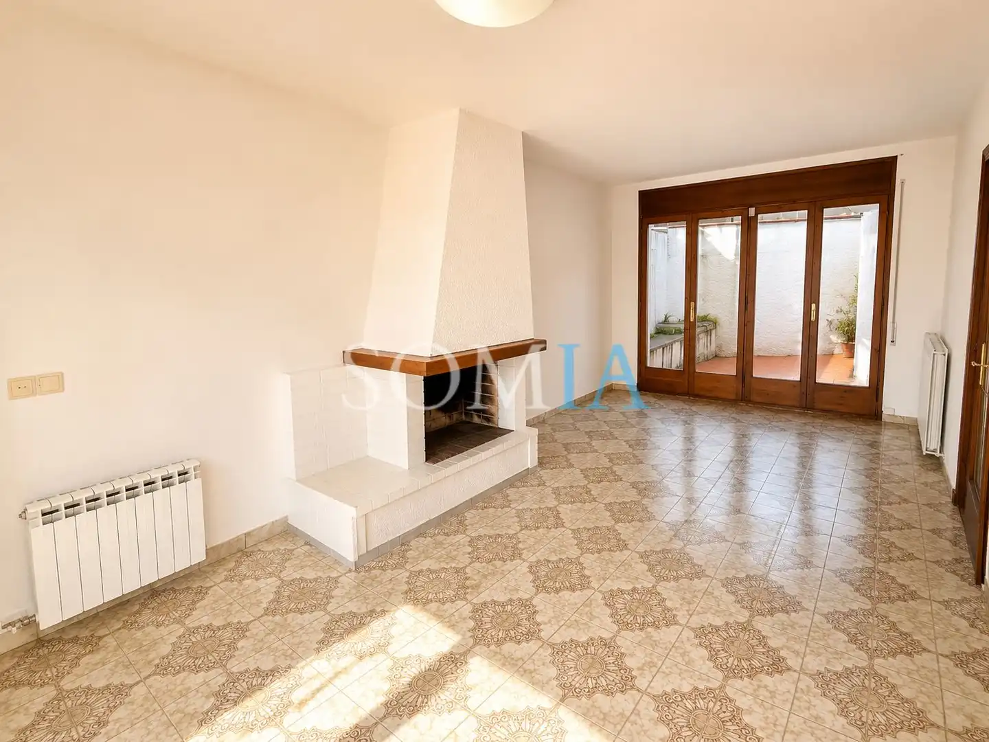 Sala de estar de Casa adosada en venta en Sant Celoni con Calefacción, Jardín privado y Trastero