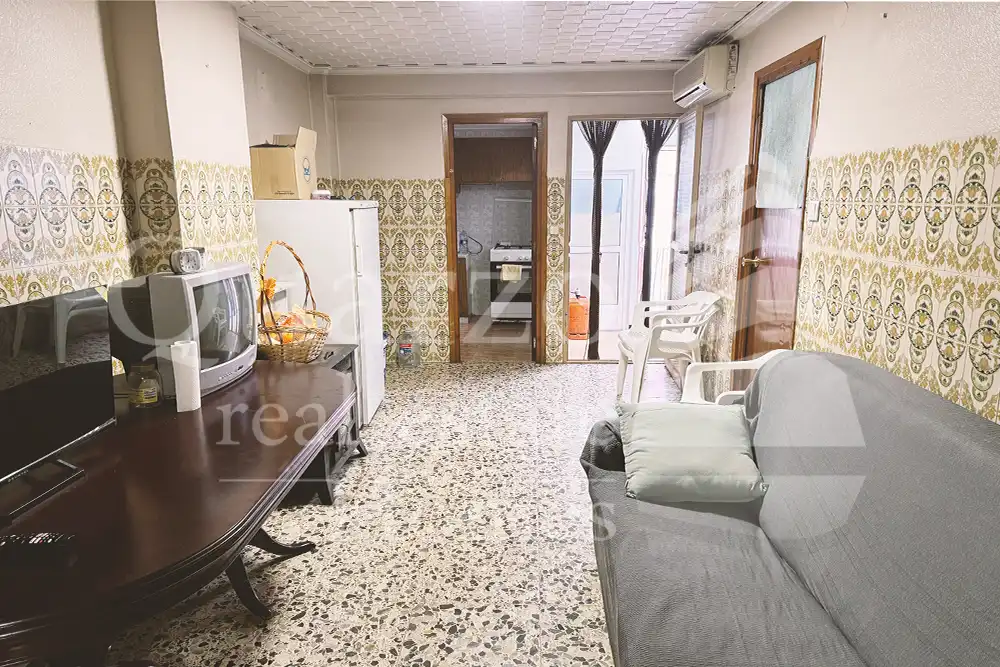 Sala d'estar de Casa adosada en venda en Real amb Traster i Moblat