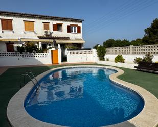 Swimming pool of Single-family semi-detached for sale in El Vendrell  with Air Conditioner, Heating and Parquet flooring