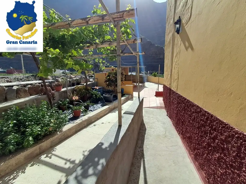 Außenansicht von Wohnung zum Verkauf in Mogán mit Privatgarten und Terrasse